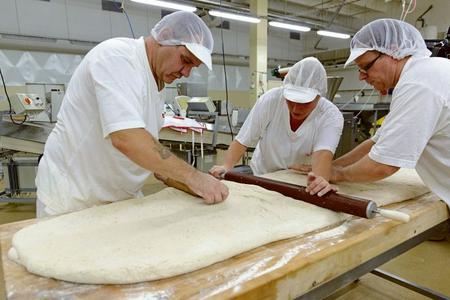 Bakers in Nitra making a record loaf of bread. 