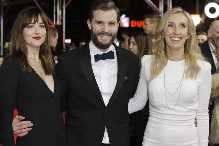 Dakota Johnson (aka Anastasia Steel), Jamie Dornan (Christian Grey) and director Sam Taylor-Johnson (L-R)