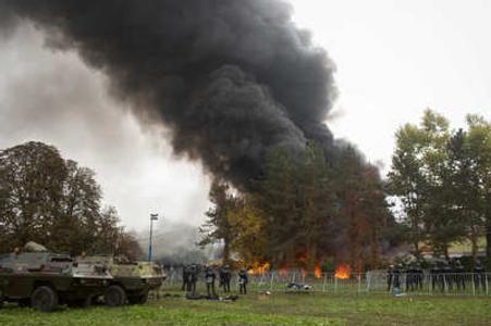 Impatient refugees set some tents on fire on Ocotber 21, in the Slovenian Brezica camp close to Croatian border.