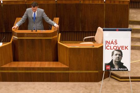 Daniel Lipšic, the poster next to him shows tycoon Bašternák.