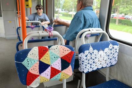 Tram with colourful crochet rugs