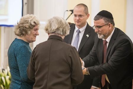 Two daughters of Jozef Krajčovič and his wife Anna taking an honour for their parents who helped Jews during World War 2 from Zvi Aviner Vapni, the Ambassador of the State of Israel 