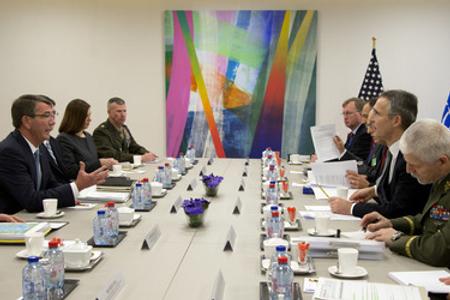 US Secretary of Defense Ash Carter (L), speaks with NATO Secretary General Jens Stoltenberg (2R) during a meeting at NATO headquarters in Brussels on February 10