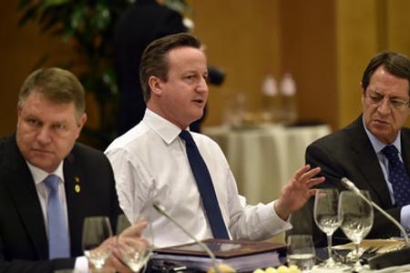 British PM David Cameron (C) at the EU summit February 19. 