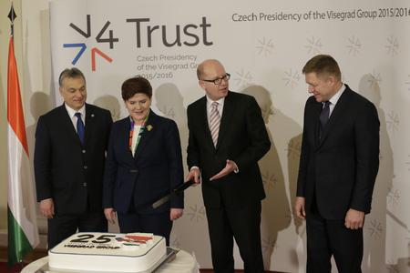 Prime Ministers of Hungary Viktor Orban, Poland Beata Szydlo, Czech Republic Bohuslav Sobotka and Slovakia Robert Fico, from left, are about to cut a cake to celebrate the 25th anniversary of the establishment of the Visegrad group prior to a Summit of the V4 Prime Ministers with the Prime Minister of Bulgaria and the President of Macedonia in Prague on February 15.