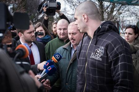 Marian Kotleba, in the middle, accompanied by his associates. 
