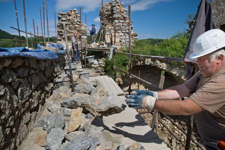 Volunteers help restore Slovakia’s castles. 