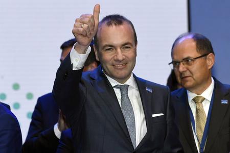 Manfred Weber of Germany wins the race to lead the European Union's center-right parties into key EU elections in May.