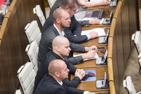 ĽSNS MPs sitting in parliament. 