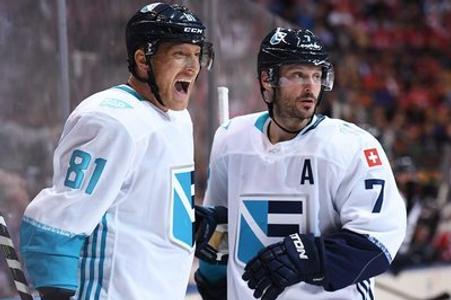 L_R: Marian Hossa celebrates his goal with teammate Mark Streit. 
