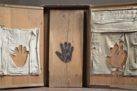 The wooden box with burnt prints.
