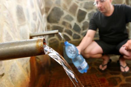 Both bottled waters and natural sources include micro-plastics, illustrative stock photo.