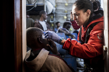 A migrant receives medical assistance after being rescued.