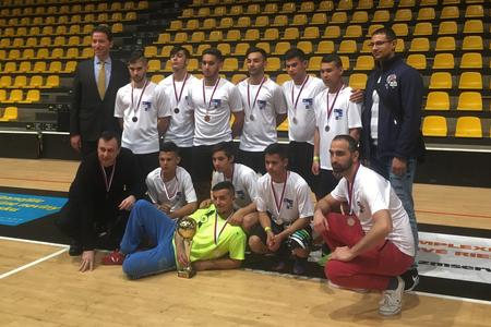 US Ambassador Adam Sterling poses with the victorious Roma players from Humenne and Moldava nad Bodvou.