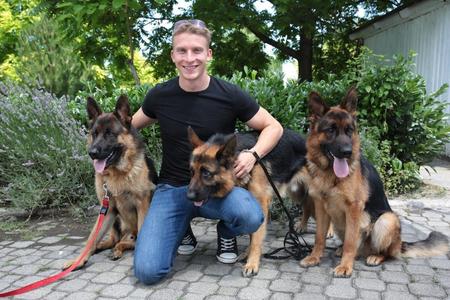 Actor Juraj Bača with three animal actors of inspector Rex - Odin, Rex and Arti. 