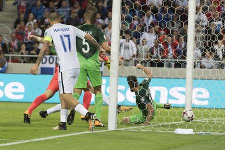 World Cup qualification 2018: Slovakia's Adam Nemec, obscured, scores a goal against Slovenia during their 2018 World Cup Russia group F qualification soccer match between Slovakia and Slovenia in Trnava, Slovakia, September 1.