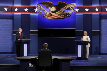 Democratic presidential nominee Hillary Clinton answers a question as Republican presidential nominee Donald Trump listens during the third presidential debate at UNLV in Las Vegas on October 19.