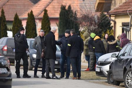 Róbert Krajmer (second left) at the crime scene in front of Ján Kuciak's house.