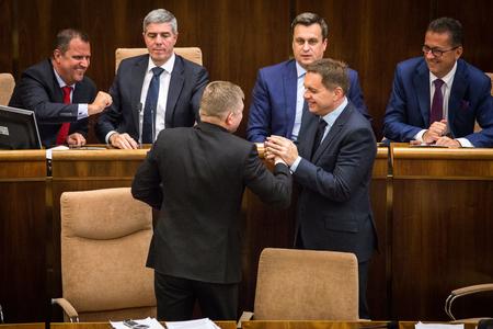 Deputy speakers of parliament Andrej Hrnčiar and Béla Bugár (both Most-Híd), PM Robert Fico (Smer), Speaker of Parliament Andrej Danko (SNS), Finance Minister Peter Kažimír (Smer) and Deputy Speaker of Parliament Martin Glváč (Smer), from left, after parliament adopted the state budget.