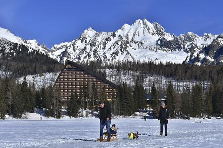 Walking on frozen lake in High Tatras.