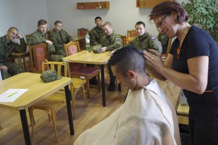 Cutting of hairs prior to starting voluntary military training. 