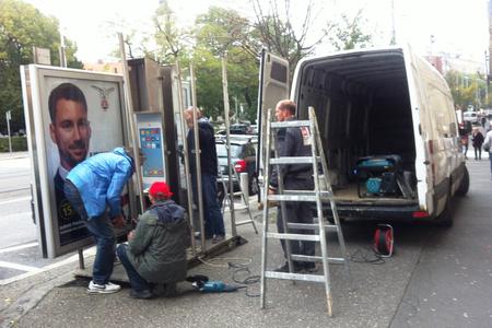 Removing unused telephone booths in the Old Town.