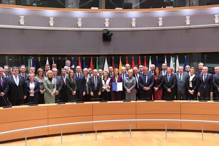EU foreign policy chief Federica Mogherini, centre, poses with EU foreign and defense ministers after signing the notification on Permanent Structure Cooperation (PESCO) on November 13 in Brussels. 