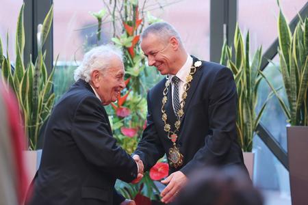 Banská Bystrica mayor Ján Nosko (right) awards war veteran Vladimír Strmeň (left) in 2015.