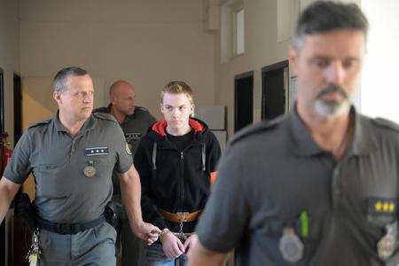 The driver of the car fleeing police, in which an innocent youth was shot down, leaves court on June 27, 2018.