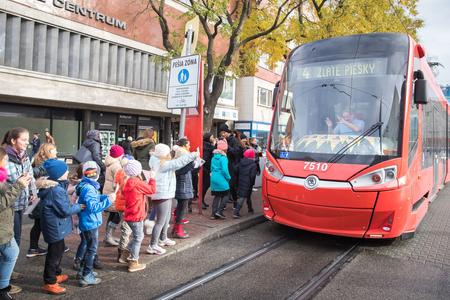 Superar children's choir wait for the driver to sing for his birthday. 