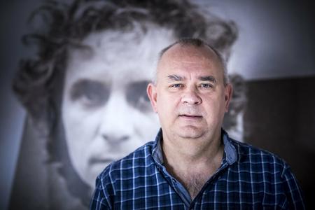 Alexej Fulmek, with the picture of Karol Jezik in the background. 