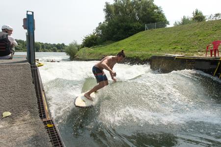 Surfing on the man-made wave in Divoká Voda resort in Čunovo.