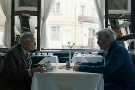 L-R: Jiří Menzel and Peter Simonischek in The Interpreter.