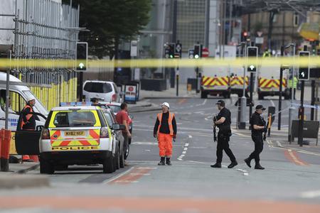 Police guard close to the Manchester Arena in Manchester, Britain, on May 23, 2017, a day after an explosion.