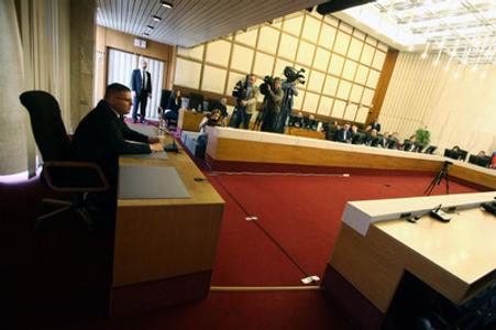ÚVO head candidate Peter Kubovič (L) at a public hearing by cabinet, May 24. 