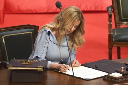 Zuzana Caputova swears the presidential oath into the hands of Constitutional Court President Ivan Fiacan. 
