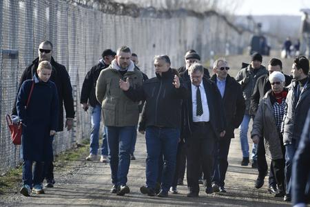 Hungarian PM Viktor Orbán (centre) and his Slovak counterpart Peter Pellegrini (centre-left) during their visit at the transit zone for migrants in Röszke on the Hungarian-Serbian border.