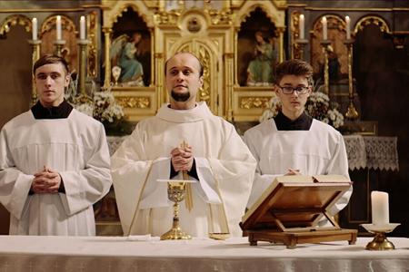 Actor Daniel Fischer portrays a Catholic priest in Škop's film Nech je svetlo (Let There Be Light).