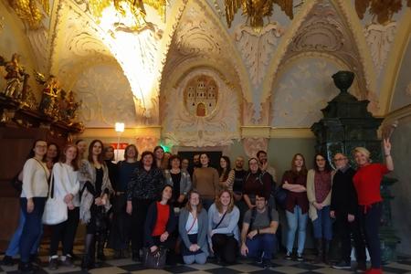 Foreigners and Slovaks in Bratislava pose in the beautiful interior of the Old Town Hall.