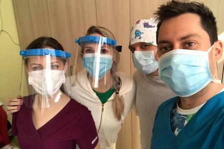 Shields protect hospital staff from the virus.