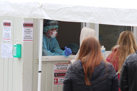 Patients waiting in front of the University Hospital Bratislava to be tested.