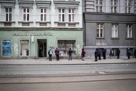 New measures came in force on March 30, resulting in people waiting in queues in front of several shops.