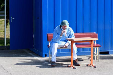 A medical worker eats during his break.