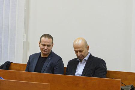 Police investigator Štefan Mlynarčík (left)and Miroslav Kriak (right), both witnesses, attend a court hearing in the Kuciak case at the Specialised Criminal Court in Pezinok on January 15, 2020. 