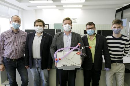Young Slovak scientists brothers Samuel Furka (in the middle) and Daniel Furka (second left), senior doctor Patrik Palacka (second right),  Michal Géci, coordinator of the humanitarian project (left) and student Dalibor Gallik (right).
