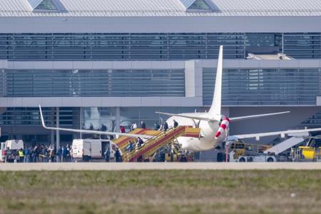Slovaks get off a plane from Stockholm, Sweden, which landed at Bratislava airport on March 29, 2020.