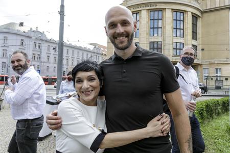 Irena Bihariová and Michal Truban, new and former chairs of Progressive Slovakia, hug each other in Bratislava on June 6, 2020.