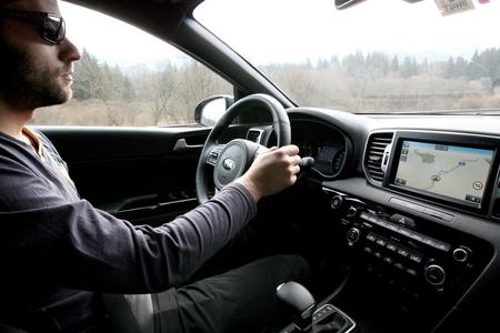 Holding a cell phone while driving gets a ban after the parliament has approved changes to the law on road traffic