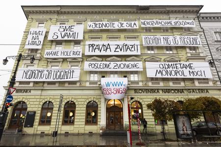 A total of 11 hand-written large-format banners are placed on the facade of the Esterházy Palace of the Slovak National Gallery (SNG)in Bratislava in November 2019. They were created by Tomáš Gažovič as part of a digital project entitled Time-Description 1989 (Čas-opis 1989) and dedicated to the 30th anniversary of the Velvet Revolution