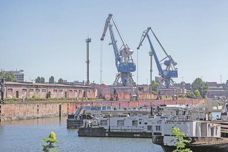 The Bratislava Winter Port with ships, warehouses and cranes.